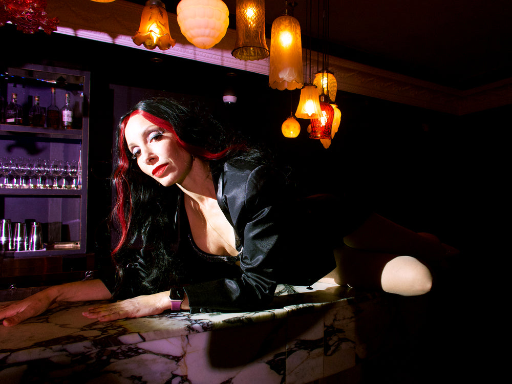Friday 3rd October tickets available to this Sydney CBD show this weekend. Glamorous woman lying on vintage bar in background. Weekend date showing tickets available in front. 